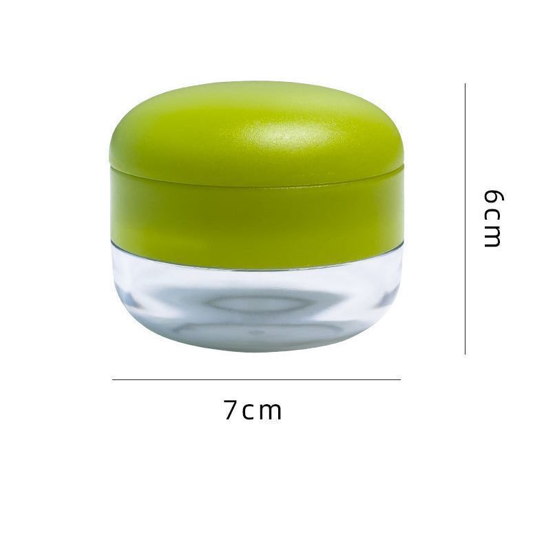 Compact garlic press with collection tray