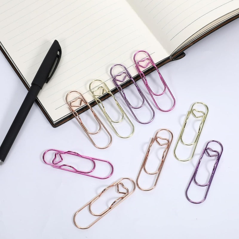 Heart-shaped paper clip – Holds a pen
